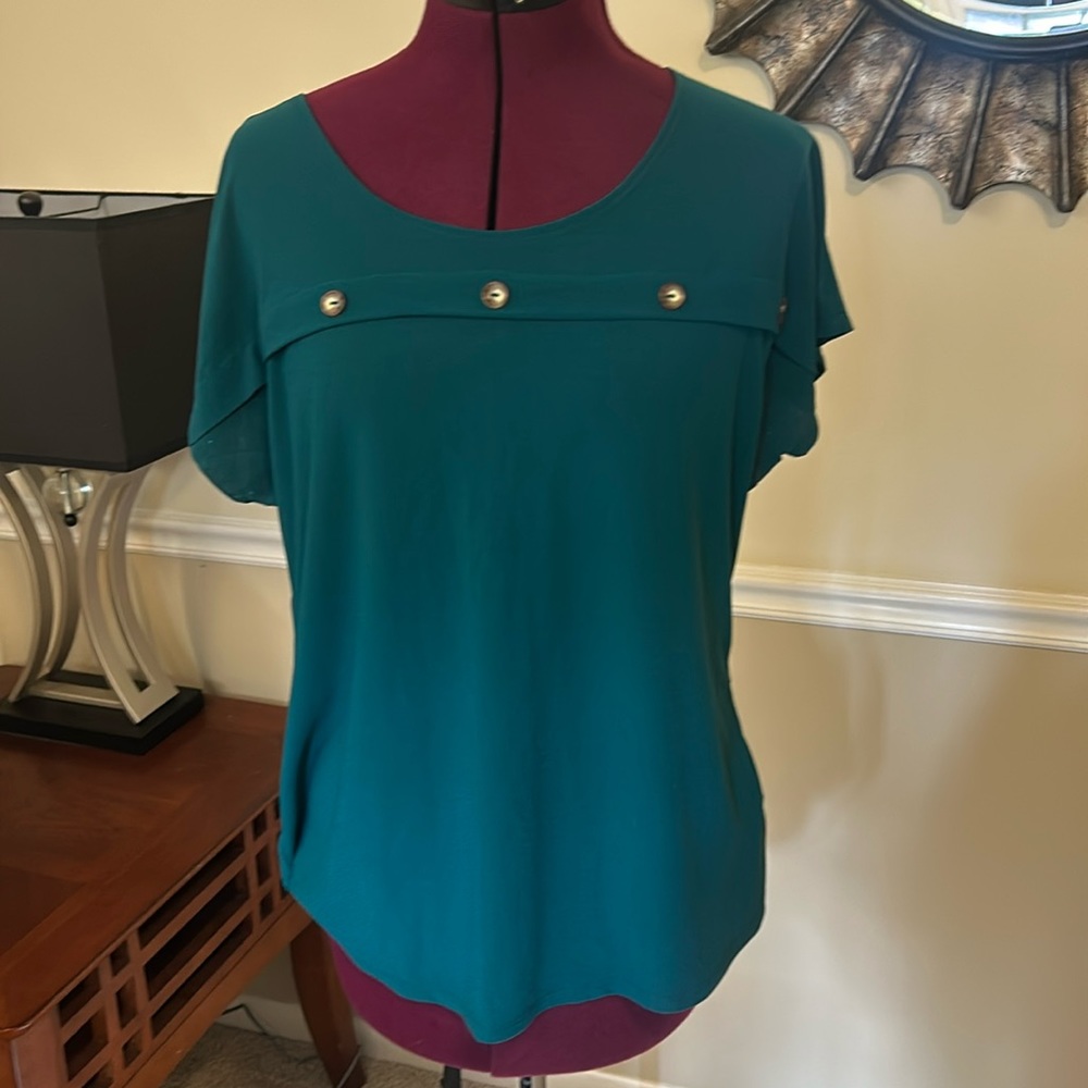 Green top with button accents